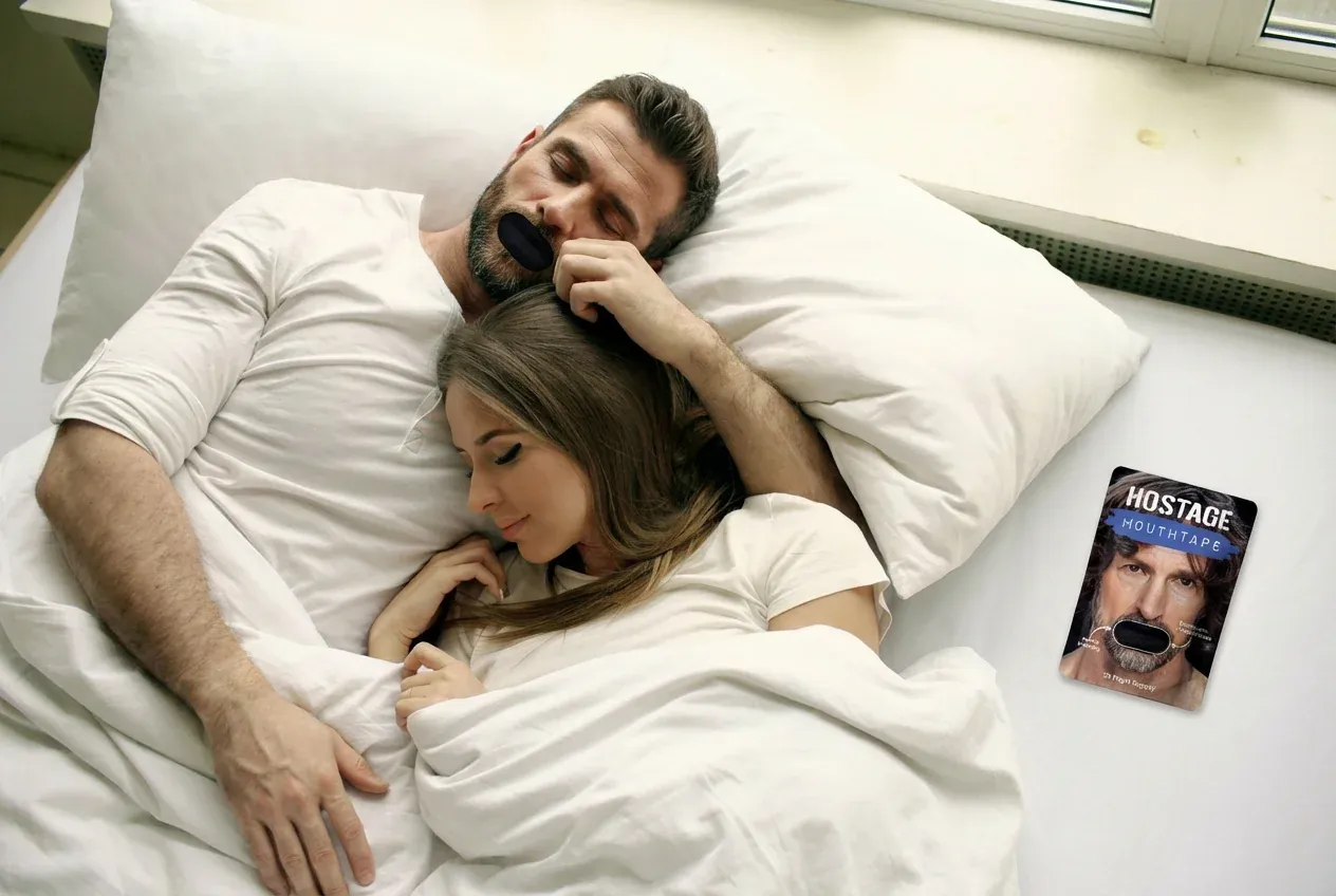 Couple sleeping together with Hostage Tape - man wearing mouth tape with product packaging visible